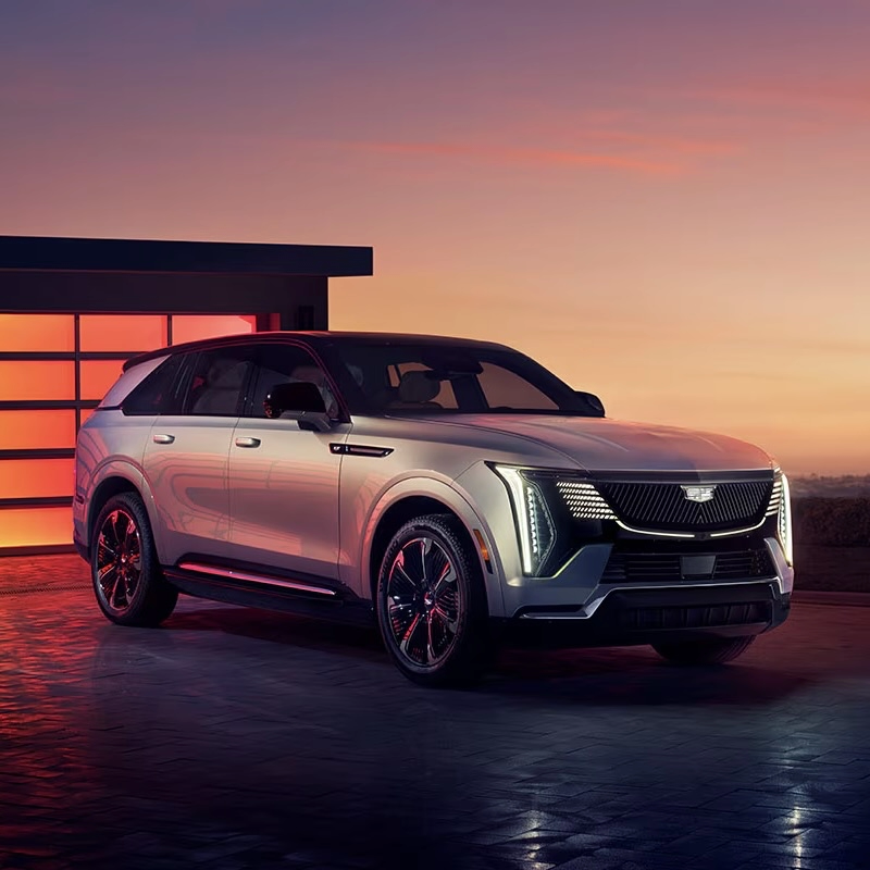 The Cadillac Escalade IQ 2025 parked in front of a residence.