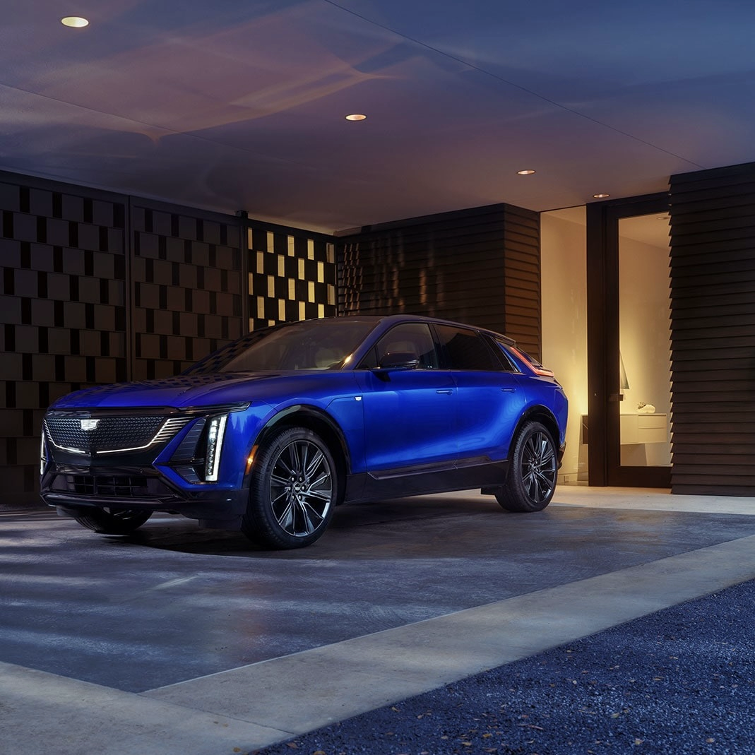 The Cadillac Lyriq 2025 parked in front of a residence.