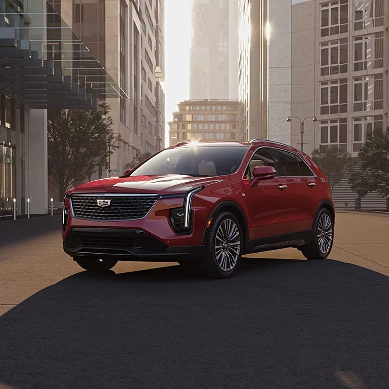 The Cadillac XT4 2025 parked in the middle of the road in the city.